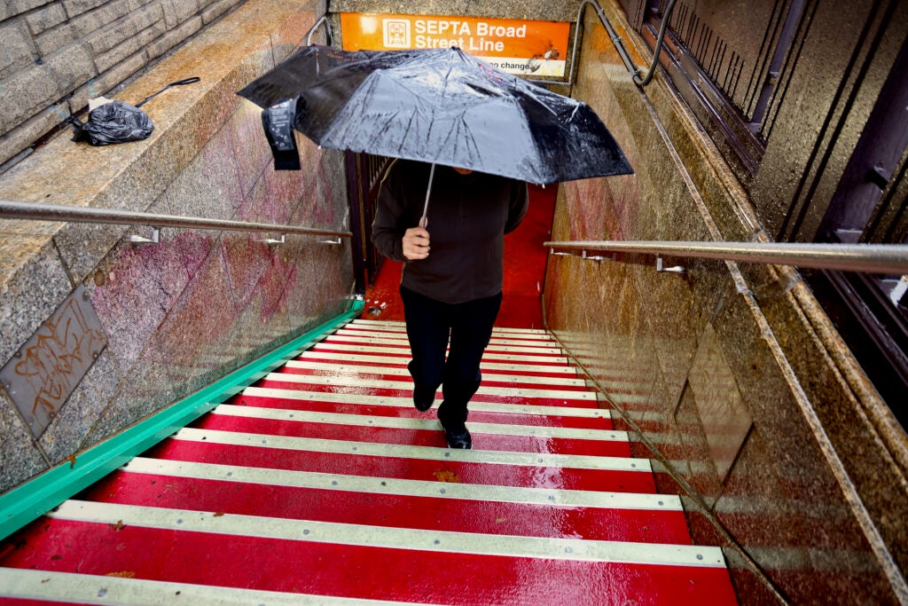 Siti climbing the stairs for the subway