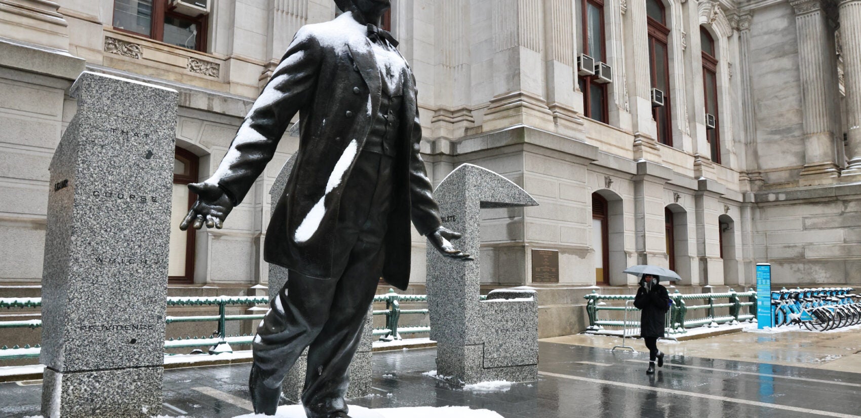 The Octavius Catto statue at Philadelphia City Hall is coated in snow and ice