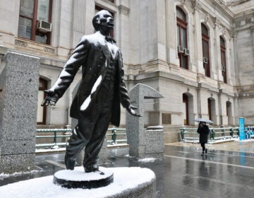 The Octavius Catto statue at Philadelphia City Hall is coated in snow and ice