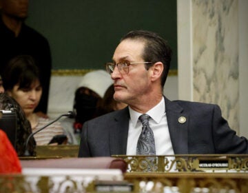 Philadelphia City Councilmember Jim Harrity at his desk in City Council chambers