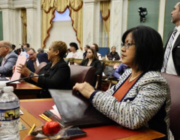 Philadelphia City Councilmember Nina Ahmad seated at her desk in City Council chambers at City Hall