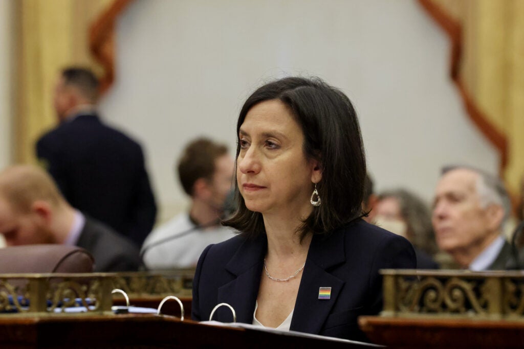 Philadelphia City Councilmember Rue Landau seated at her desk at City Council chambers at City Hall.