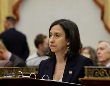 Philadelphia City Councilmember Rue Landau seated at her desk at City Council chambers at City Hall.