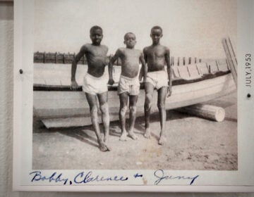 In a photo from 1953, boys puff out their chests for the photographer on Grant Street Beach. (Emma Lee/WHYY)