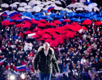 ussian President Vladimir Putin arrives to attend a concert marking the seventh anniversary of the referendum on the state status of Crimea and Sevastopol and its reunification with Russia, in Moscow, Russia, Thursday, March 18, 2021. (Alexei Druzhinin, Sputnik, Kremlin Pool Photo via AP)