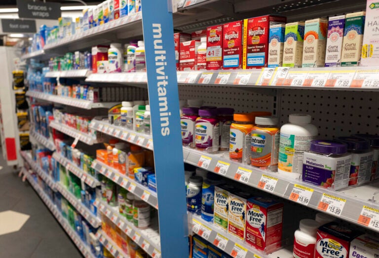 Vitamins are displayed in pharmacy Duane Reade by Walgreens, Thursday, March 25, 2021, in New York. Walgreens reports earnings March 31, 2021. (AP Photo/Mark Lennihan)