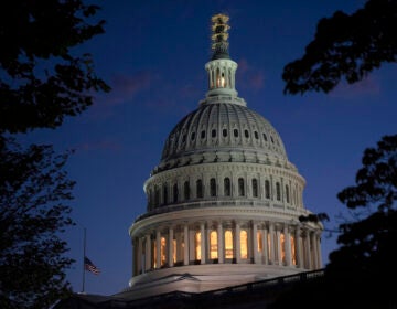 Night falls on the dome of the Capitol in Washington.