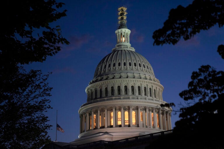 Night falls on the dome of the Capitol in Washington.