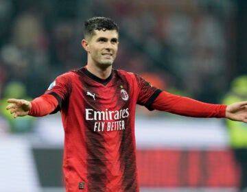 AC Milan's Christian Pulisic smiles at the end of the Serie A soccer match between AC Milan and Sassuolo at the San Siro stadium, in Milan, Italy, Saturday, Dec. 30, 2023. Pulisic scored the goal in Milan's 1-0 win.