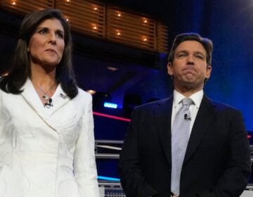 Republican presidential candidates former UN Ambassador Nikki Haley and Florida Gov. Ron DeSantis stand on stage before a Republican presidential primary debate hosted by NBC News Wednesday, Nov. 8, 2023, at the Adrienne Arsht Center for the Performing Arts of Miami-Dade County in Miami. (AP Photo/Wilfredo Lee)