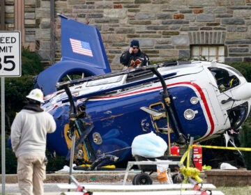 File photo: A medical helicopter rests next to the Drexel Hill United Methodist Church after it crashed the day before in the Drexel Hill section of Upper Darby, Pa., Jan. 12, 2022.