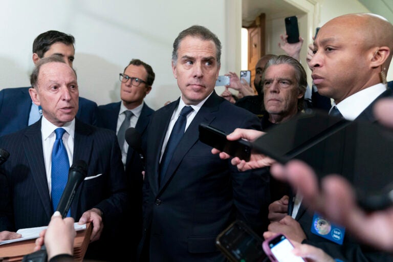 Hunter Biden, President Joe Biden's son, accompanied by his attorney Abbe Lowell, talks to reporters as they leave a House Oversight Committee hearing as Republicans are taking the first step toward holding him in contempt of Congress, Wednesday, Jan. 10, 2024, on Capitol Hill in Washington.  (AP Photo/Jose Luis Magana)