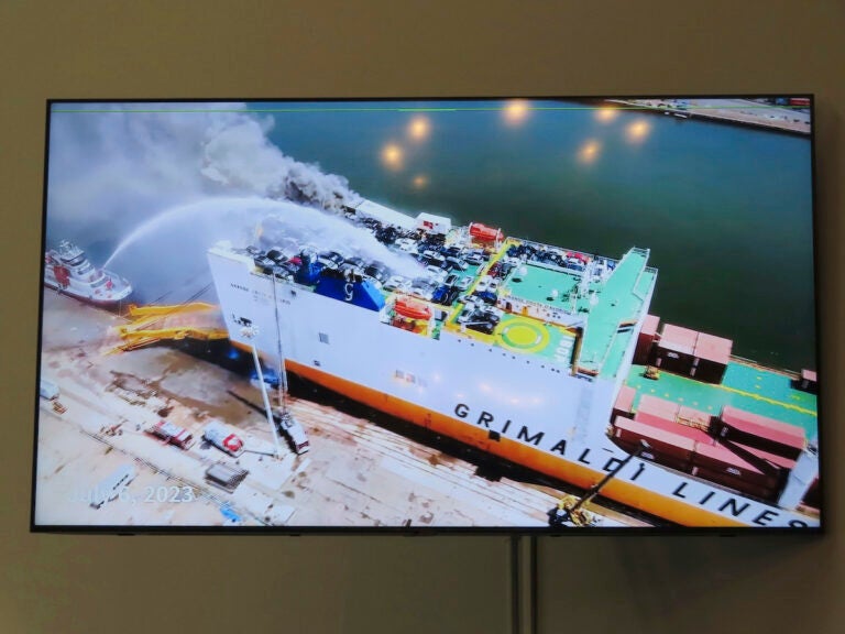 A photo displayed on a video monitor in Union,N.J., Wednesday, Jan. 10, 2024 shows a burning cargo ship in Newark N.J. on July 5, 2023.