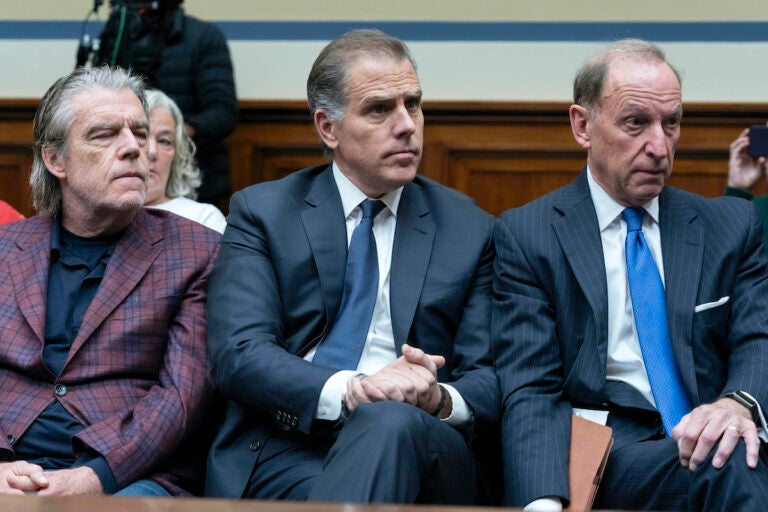 Hunter Biden, President Joe Biden's son (center) accompanied by his attorney Abbe Lowell (right) sit in the front row at a House Oversight Committee hearing as Republicans are taking the first step toward holding him in contempt of Congress, Wednesday, Jan. 10, 2024, on Capitol Hill in Washington.