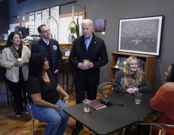President Joe Biden talks to employees at the Nowhere Coffee shop, during a visit to discuss his economic agenda, Friday, Jan. 12, 2024, in Emmaus, Pa. (AP Photo/Evan Vucci)