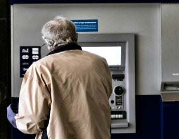File photo: A customer makes a transaction at an automatic teller machine in Los Angeles on March 27, 2023.