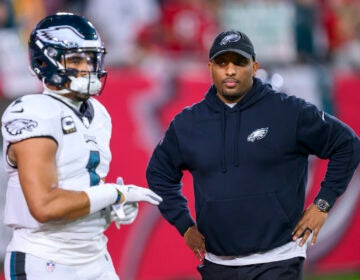 File photo: Philadelphia Eagles offensive coordinator Brian Johnson watches quarterback Jalen Hurts (1) practice on the field before an NFL wild-card playoff football game against the Tampa Bay Buccaneers, Monday, Jan. 15, 2024 in Tampa, Fla.