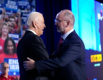 President Joe Biden is greeted by Shawn Fain, President of the United Auto Workers, as he arrives to speak to a United Auto Workers' political convention, Wednesday, Jan. 24, 2024, in Washington.