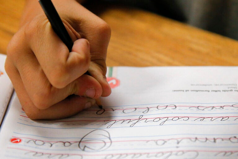 A student practices writing in cursive at St. Mark’s Lutheran School in Hacienda Heights, Calif., bucking a growing trend of eliminating cursive from elementary school curriculums or making it optional, California is among the states keeping longhand as a third-grade staple.