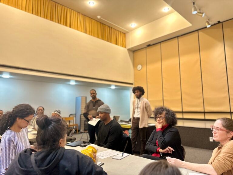 Attendees are locked in during the 15-minute discussion portion of WHYY's Building Blocks event on youth homelessness, hosted by manager of community engagement Eric Marsh Sr. and moderated by reporter Kenny Cooper.