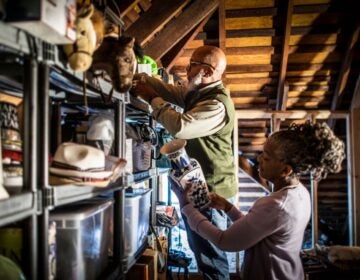 Senior couple organizing items in the home attic