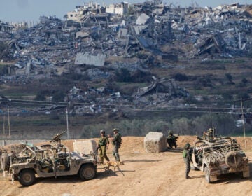 Israeli soldiers take up positions near the Gaza Strip border, in southern Israel, Friday, Dec. 29, 2023. The army is battling Palestinian militants across Gaza in the war ignited by Hamas' Oct. 7 attack into Israel. Israel and Hamas have been at war for 100 days. The war already is the longest and deadliest between Israel and the Palestinians since Israel’s establishment in 1948, and the fighting shows no signs of ending.