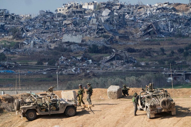 Israeli soldiers take up positions near the Gaza Strip border, in southern Israel, Friday, Dec. 29, 2023. The army is battling Palestinian militants across Gaza in the war ignited by Hamas' Oct. 7 attack into Israel. Israel and Hamas have been at war for 100 days. The war already is the longest and deadliest between Israel and the Palestinians since Israel’s establishment in 1948, and the fighting shows no signs of ending.