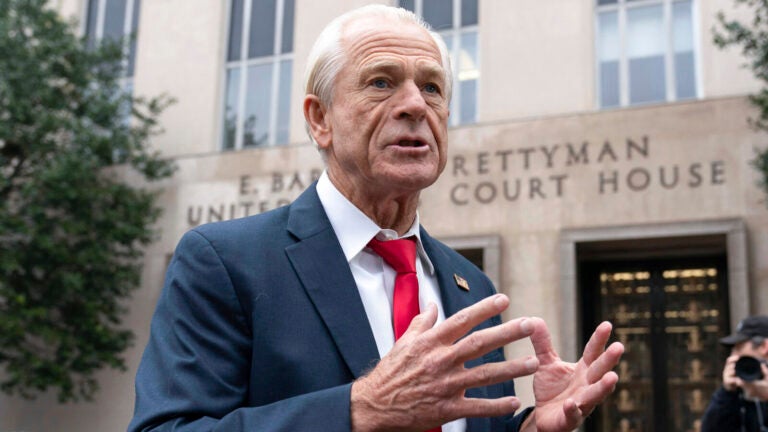 Former Trump White House official Peter Navarro talks to the media as he arrives at U.S. Federal Courthouse in Washington, Thursday, Jan. 25, 2024.