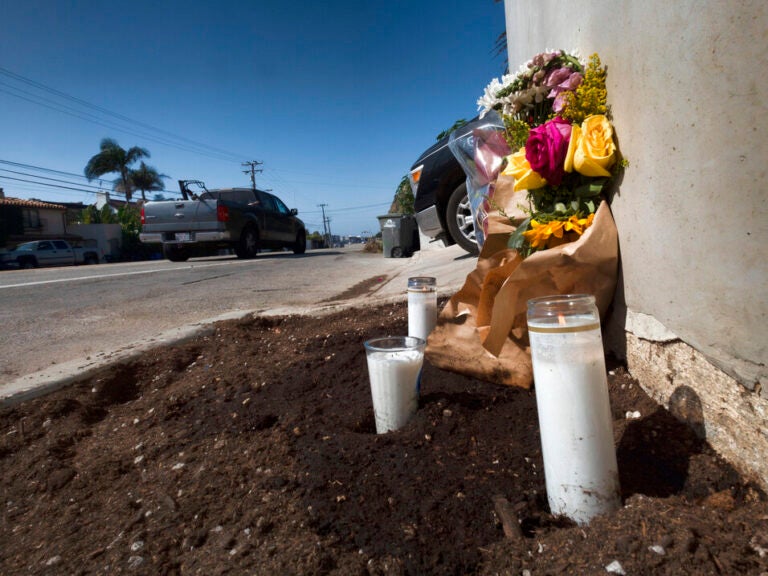 An upclose view of a memorial on the side of the road