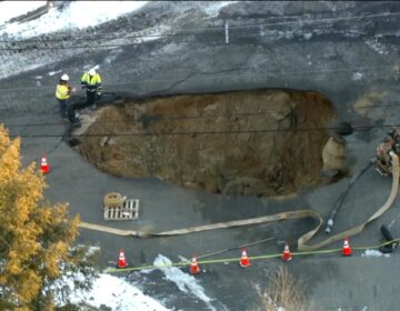 Overhead view of sinkhole in the street