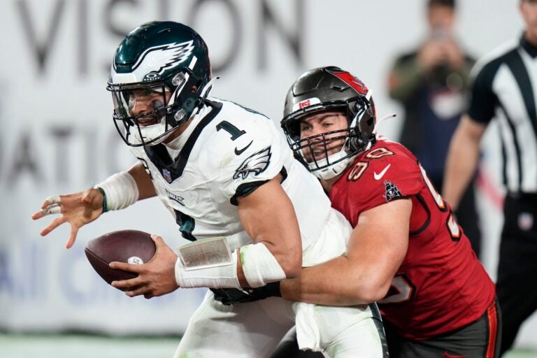 Philadelphia Eagles quarterback Jalen Hurts (1) is sacked for a safety in the end zone