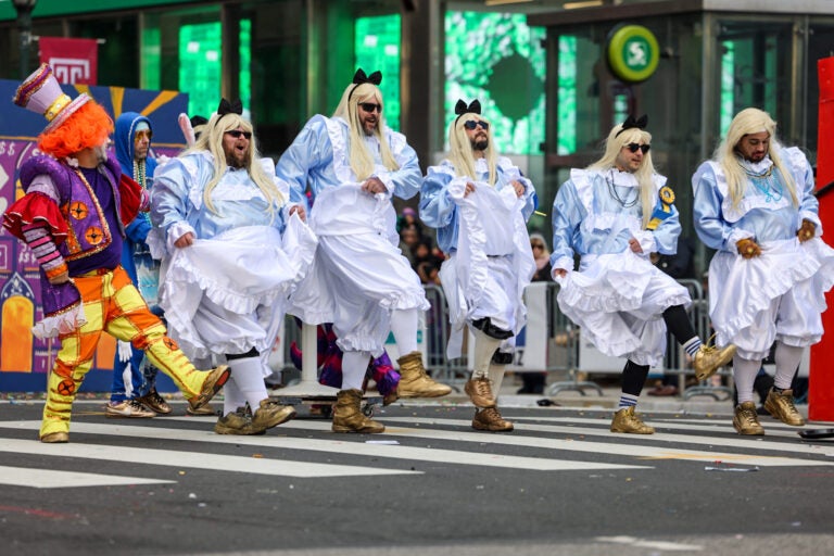 A Mummers comic club performed a sketch inspired by Alice in Wonderland at City Hall in Philadelphia