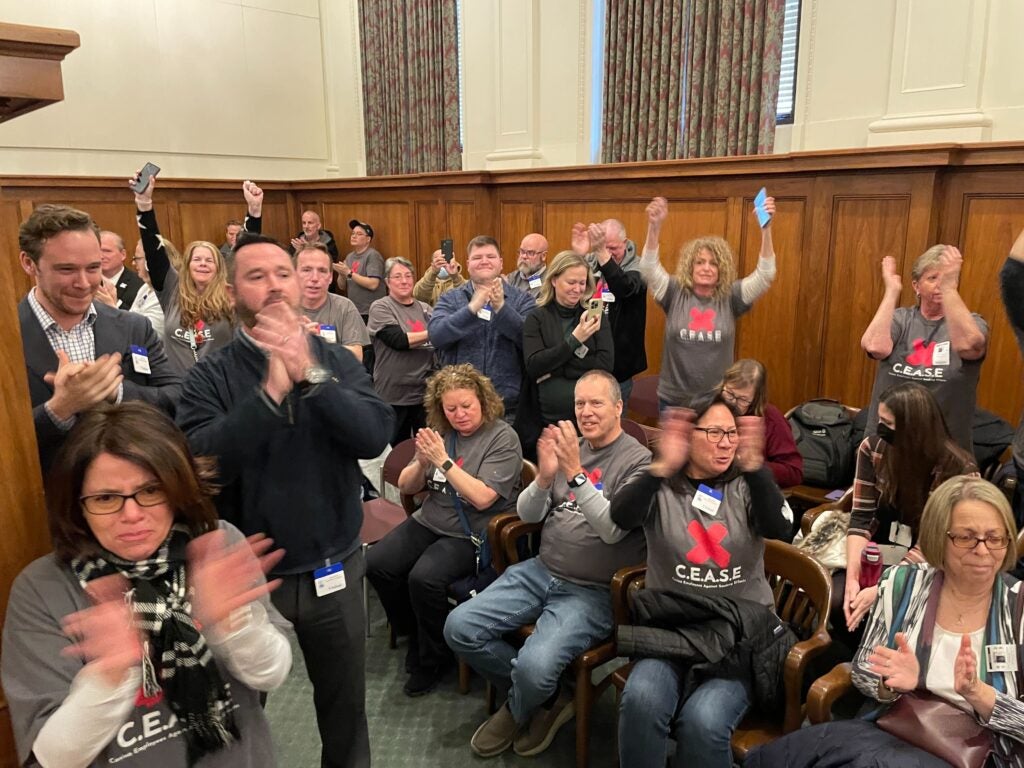 People cheering during the Senate hearing
