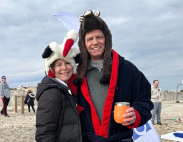 Natasha Smith-Cady (left) and Rick Cady are seen in winter outwear on a Delaware beach