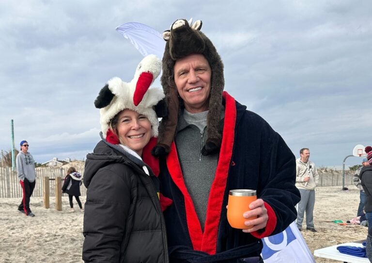 Natasha Smith-Cady (left) and Rick Cady are seen in winter outwear on a Delaware beach