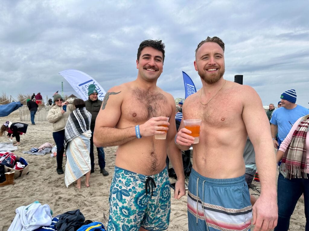 Brock Maloomian (left) and Tommy McMahon pose for a photo during a Dewey Beach polar plunge