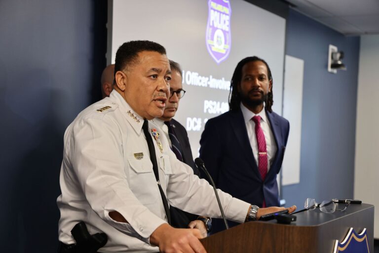 Kevin Bethel speaking at a podium