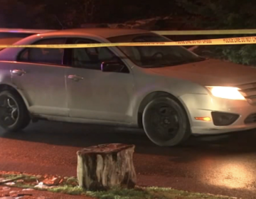 A cream-colored Ford is seen on a Philly street