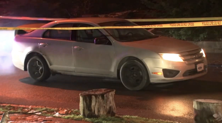 A cream-colored Ford is seen on a Philly street