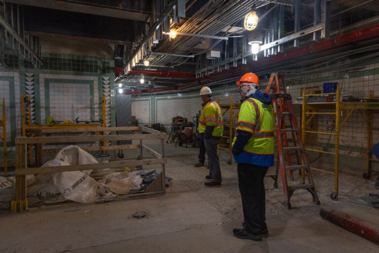 Top officials from the DRPA and PATCO survey progress below ground at Franklin Square Station in Feb., 2024.