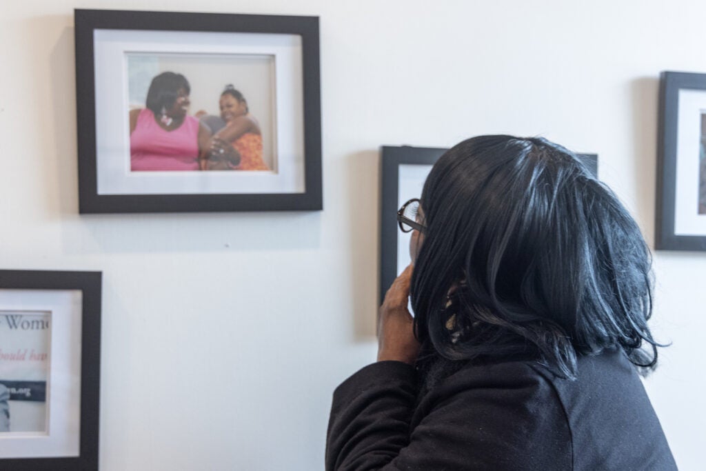 Shelia Johnson looking at a photo on the wall