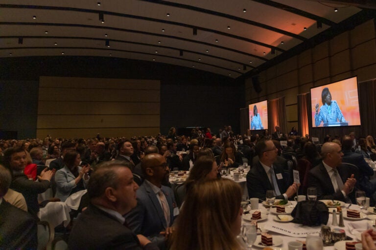 Business leaders at a Greater Philadelphia Chamber of Commerce luncheon look on as Mayor Cherelle Parker gives an official address.