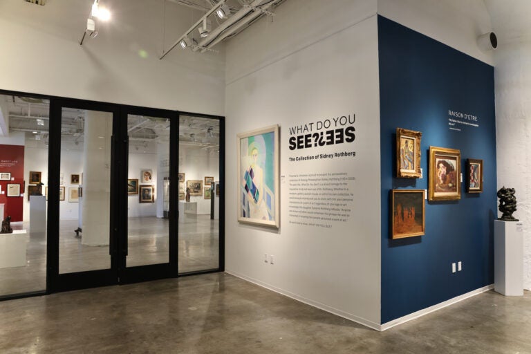 Paintings hung on the wall in the exhibition