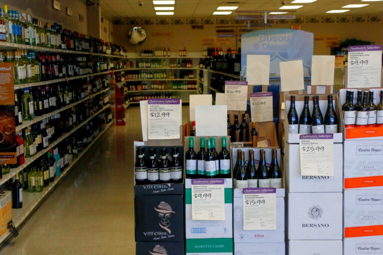 Shelves of merchandise at the Pennsylvania Wine and Liquor store in Seven Fields, Pa, are seen through the window