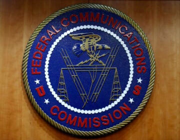 The seal of the Federal Communications Commission (FCC) is seen before an FCC meeting to vote on net neutrality, Dec. 14, 2017, in Washington. (AP Photo/Jacquelyn Martin, File)