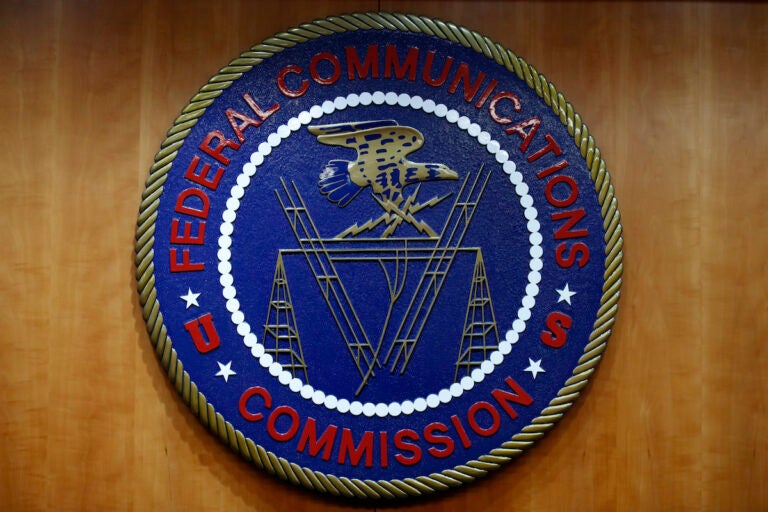 The seal of the Federal Communications Commission (FCC) is seen before an FCC meeting to vote on net neutrality, Dec. 14, 2017, in Washington. (AP Photo/Jacquelyn Martin, File)