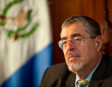 Guatemalan President Bernardo Arévalo, with the Guatemalan flag visible behind him