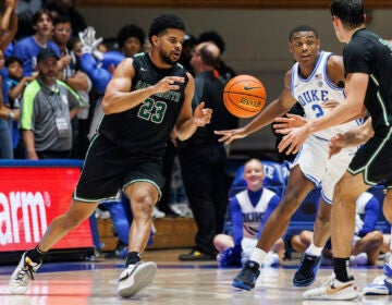 File photo: Dartmouth's Robert McRae III (23) takes a pass from Jackson Munro (33) as Duke's Jaylen Blakes (2) defends during the second half of an NCAA college basketball game in Durham, N.C., Nov. 6, 2023.