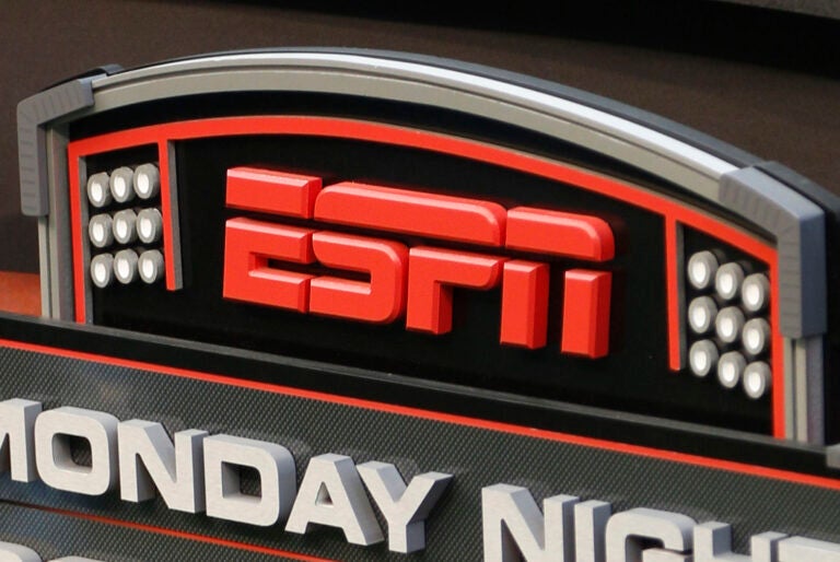 File photo: This Sept. 16, 2013, file photo shows the ESPN logo prior to an NFL football game between the Cincinnati Bengals and the Pittsburgh Steelers, in Cincinnati.