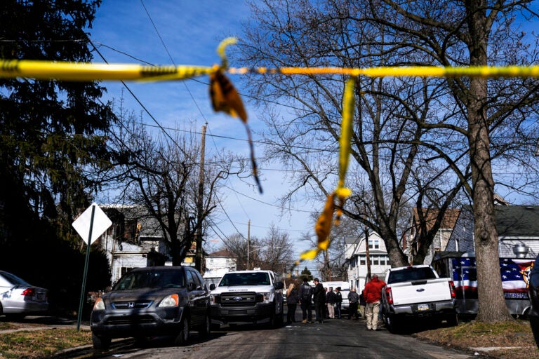 Investigators work at the scene of a shooting and house fire where six people were killed in East Lansdowne, Pa., Thursday, Feb. 8, 2024.